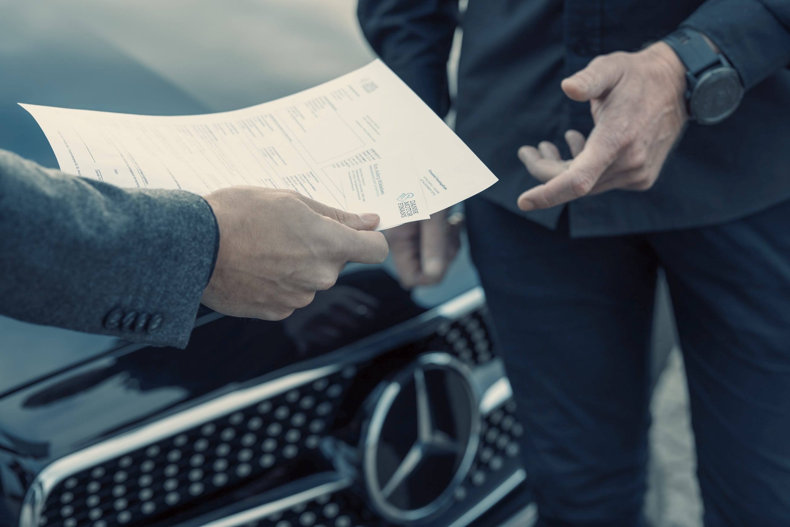 a man holding a piece of paper