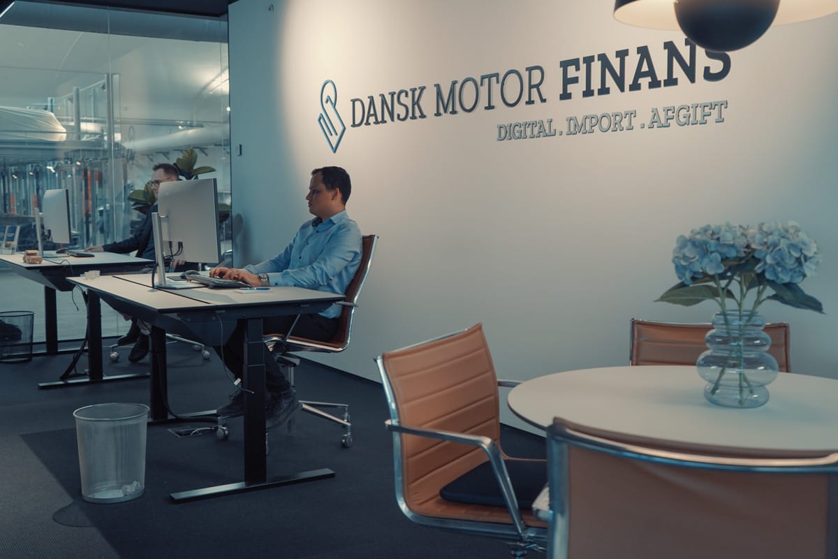 a man sitting at a desk in an office