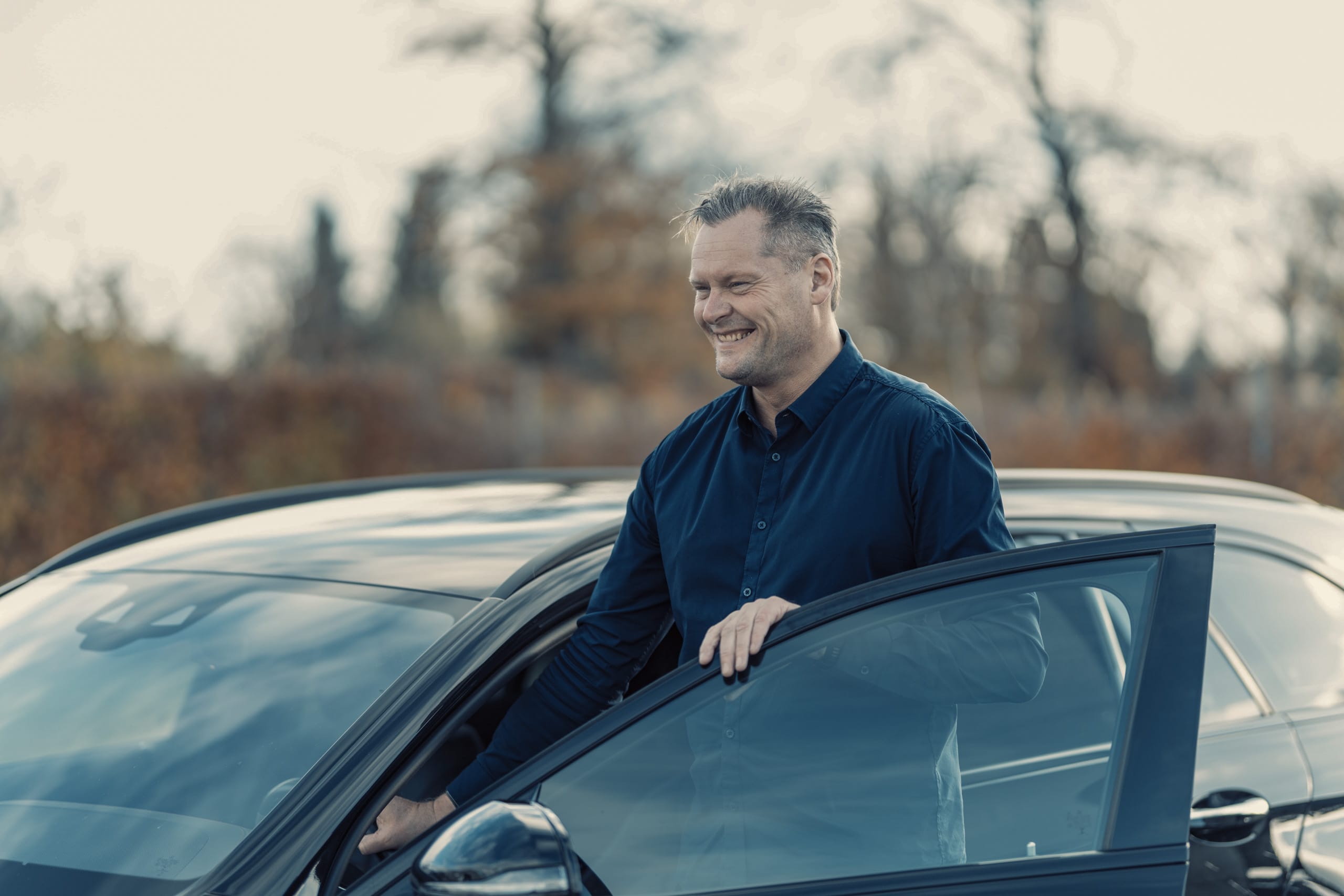 a man smiling at the camera